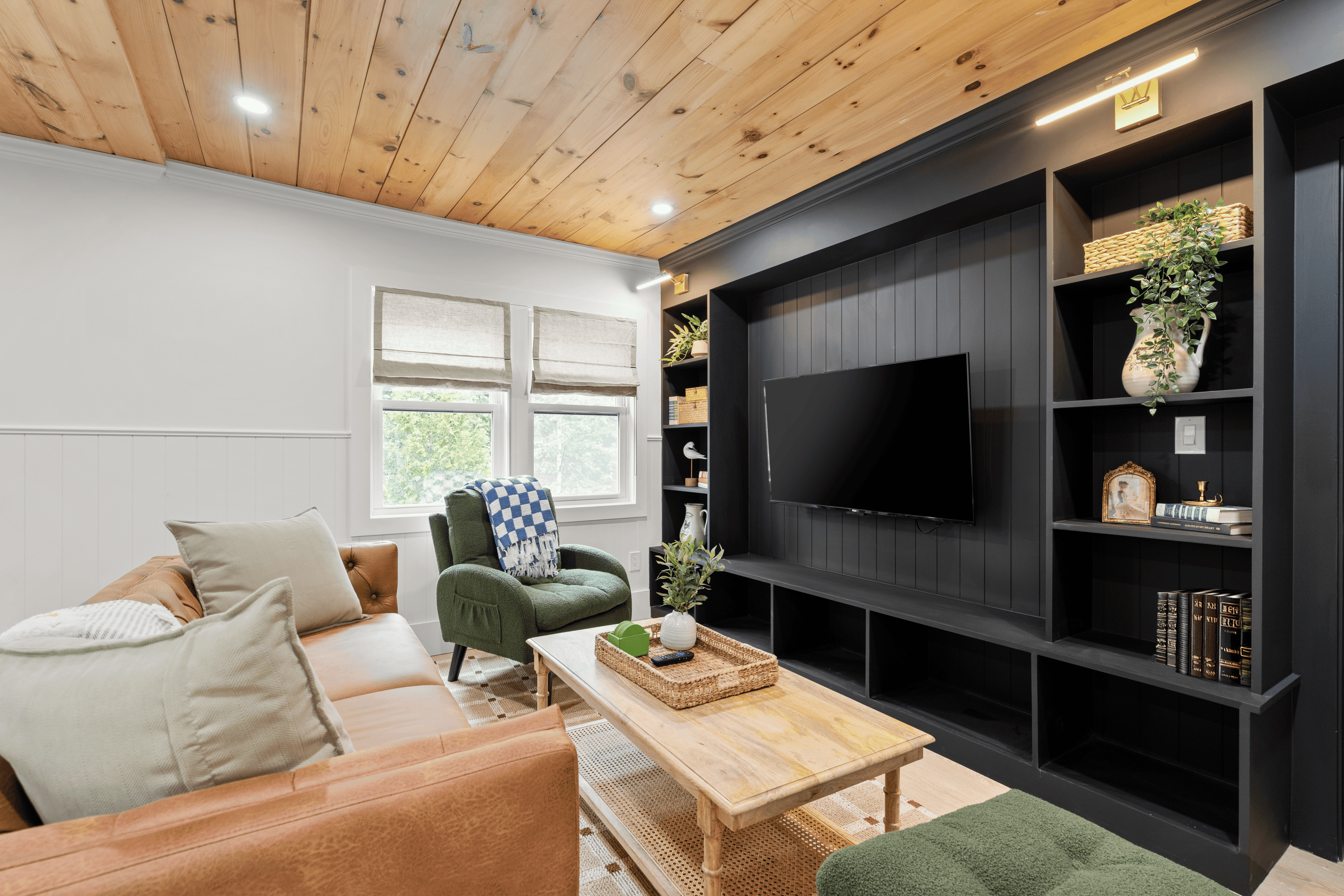 Living room with a tv, sofa and a window